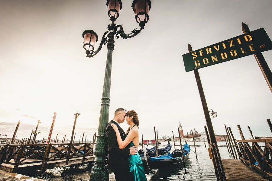 Couple posing in front of the iconic Venetian canals
