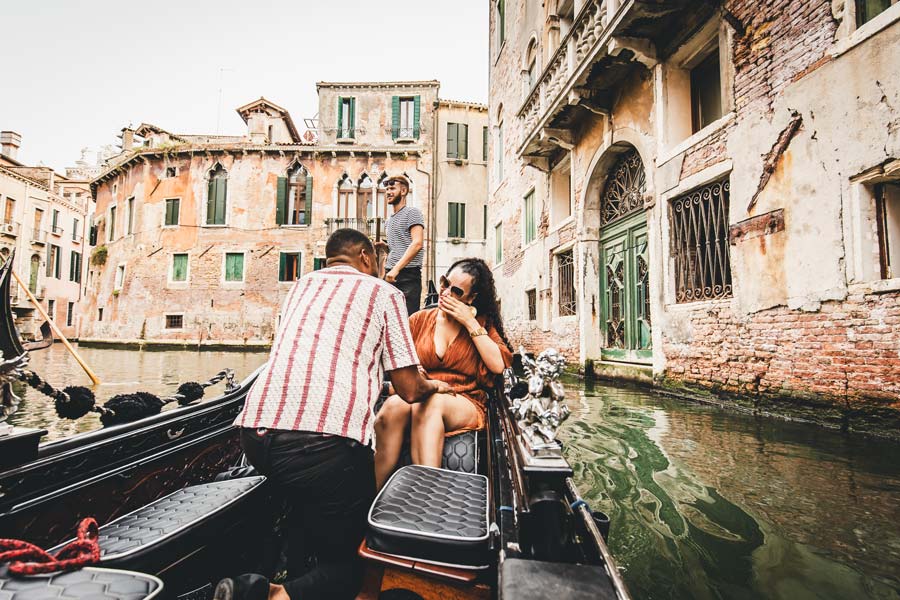 Gondolier navigating a romantic proposal ride near Bauer Venice