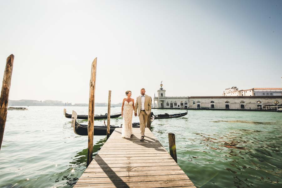 Couple walking along a quiet Venetian alley near Hotel Splendid