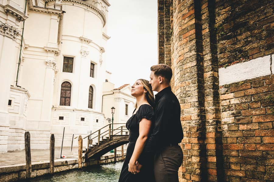 Venice sunset over Chiesa della Salute with a couple posing