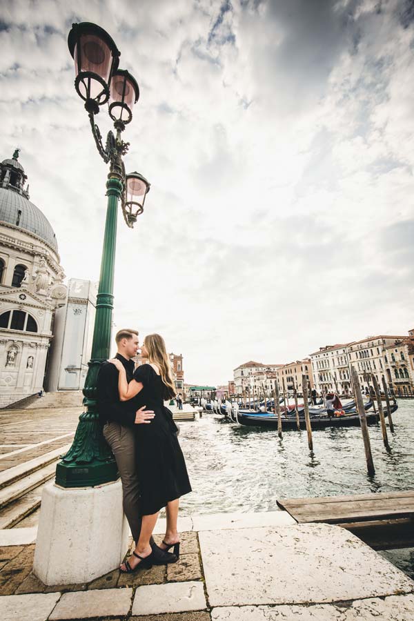 Couple walking at Punta della Dogana in Venice