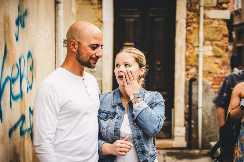 Romantic moment on a wooden bridge in Cannaregio after the proposal