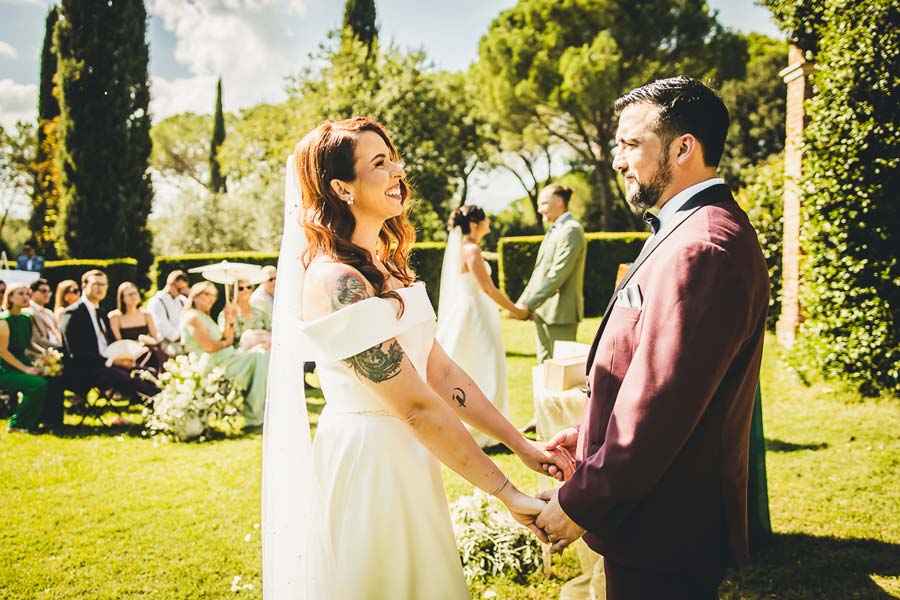 Bride preparation in a Tuscan castle room with soft window light and elegant details