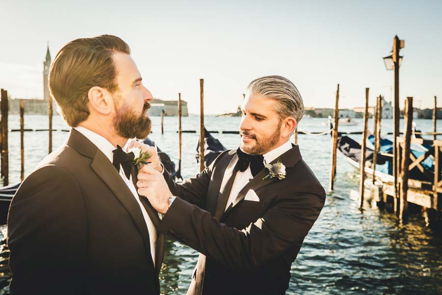 Venice elopement photographer capturing intimate moments between a same-sex couple.