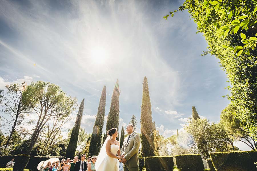 Groom getting ready in Castello di San Fabiano with classic Italian interior background