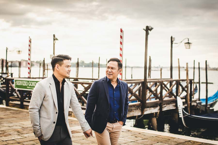 Two men on a Venetian dock at sunrise