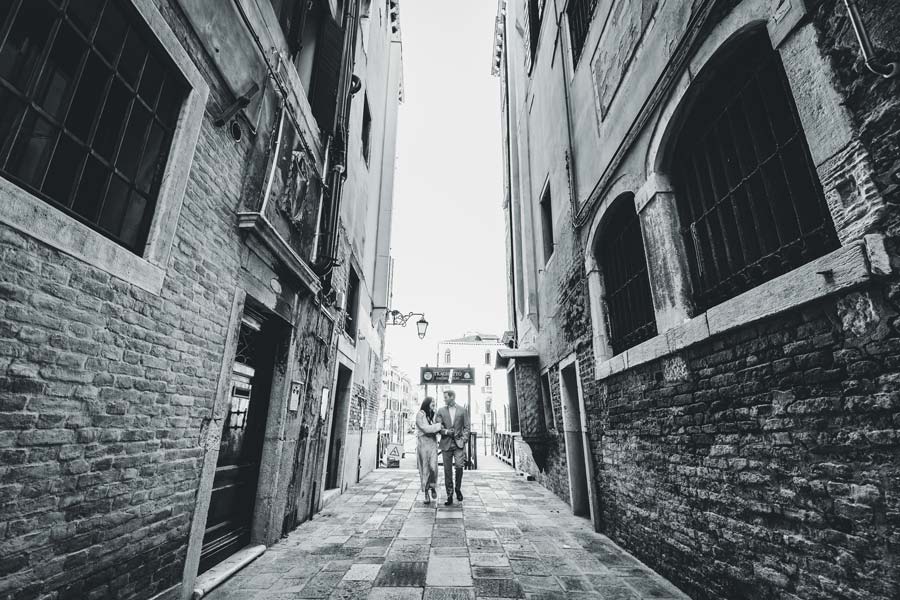 engagement in Venice with reflections and calm atmosphere