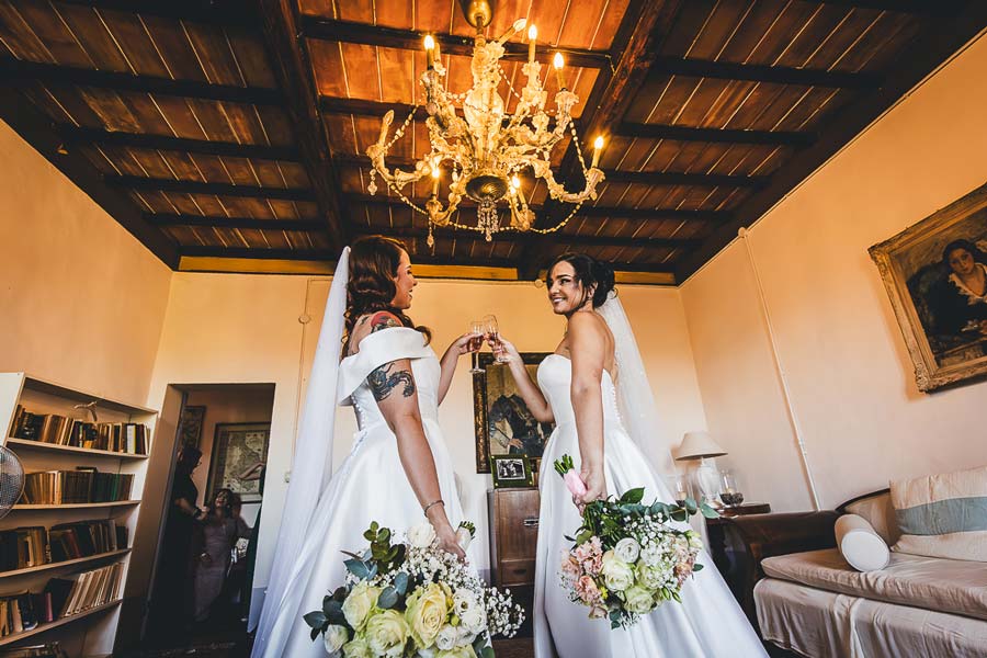 Bride and groom portrait in Tuscany countryside at Castello di San Fabiano during golden hour