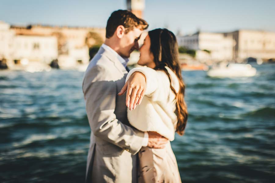 intimate engagement moment in Venice on a small bridge