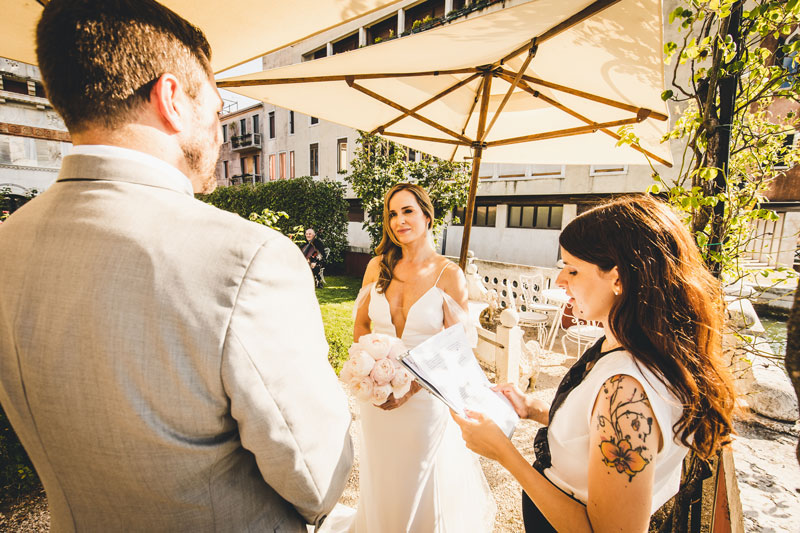 The bride and groom during their elopement ceremony at Hotel Ca' nigra in Venice