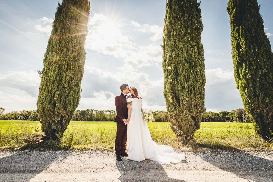 Evening wedding lights creating atmosphere in a Tuscan castle courtyard celebration