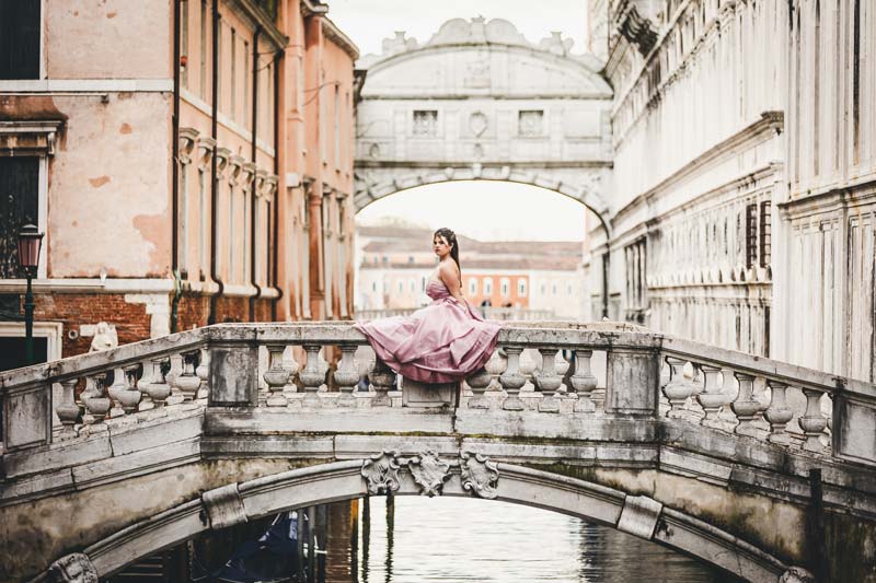 Candid moment of a young girl laughing during her Quinceañera session in Venice