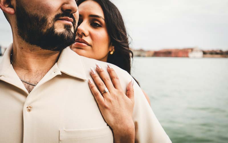 Venice couples photography shot with a couple looking out over the Grand Canal.