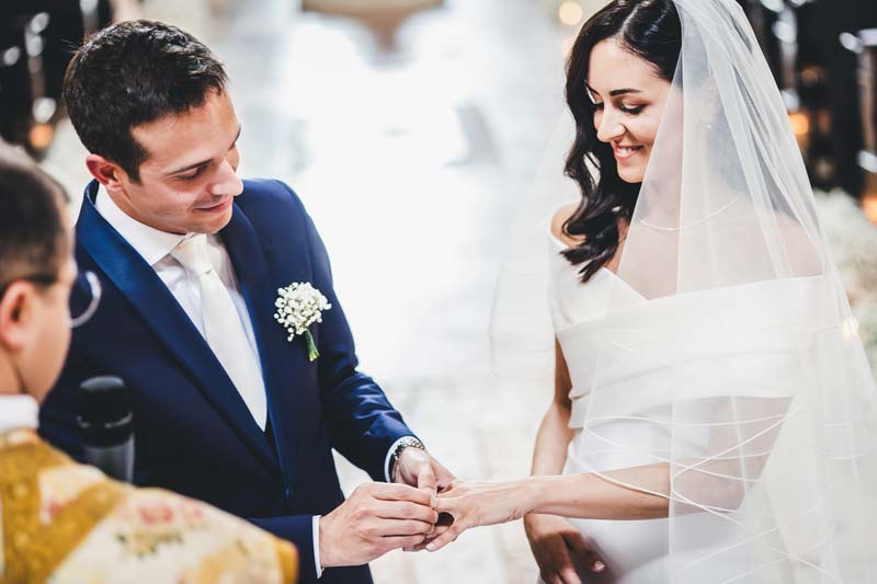 Couple exchanging vows in the historic Sala del Ridotto, Hotel Monaco.