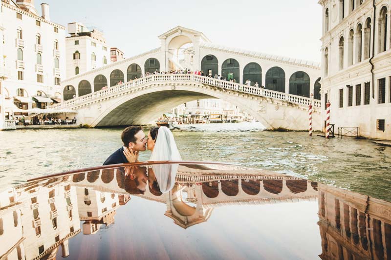 Twilight portrait of the bride and groom near rialto