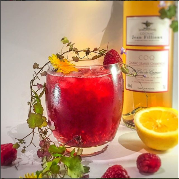 Coq Smash cocktail with Jean Fillioux Cognac Coq, fresh lime juice, raspberries and mint