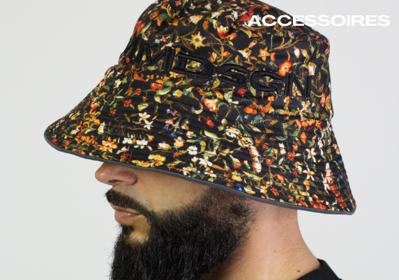 close up of male model wearing a floral patterned bucket hat with black embroidery 