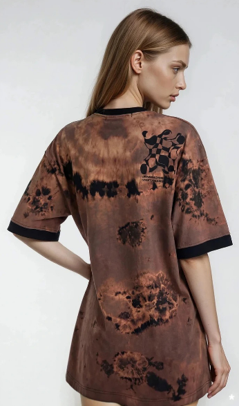 model wearing orange/black batik on back site with print  on right shoulder