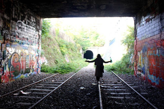 Girl balancing on tracks at Charonne, Paris