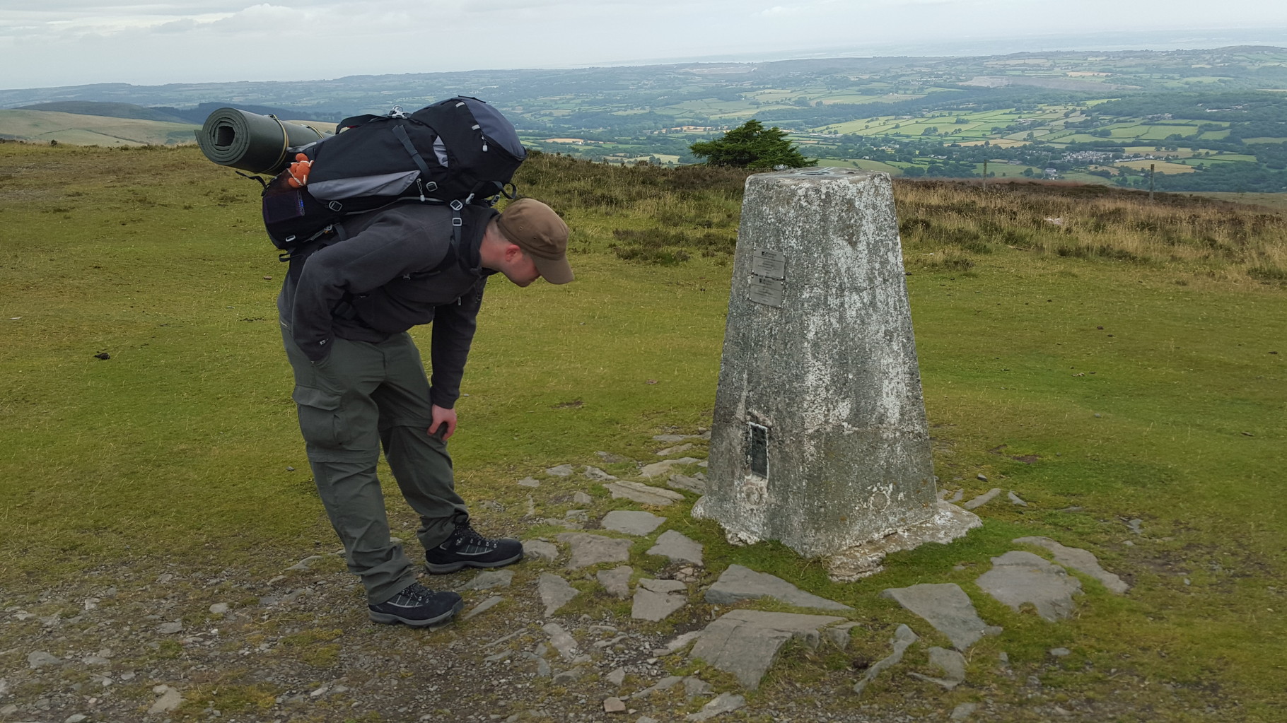 Larry checks out the trig point