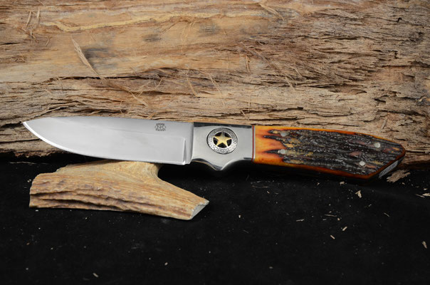 #46 Large full tang drop point.  Blade length 4 1/2" Overall 10 1/2" 440c steel.  Handle Red Dyed Stag Bone.  Nickel silver golster with star on both sides.  Maker RD Nolen  SOLD
