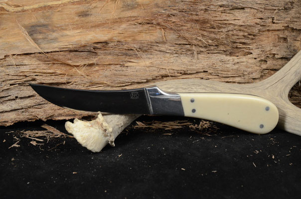 #62 Kitchen knife.  Blade length 4" Overall 8 5/8" 440c steel.  White corion handle with aluminum bolster.  Maker RD Nolen  $125