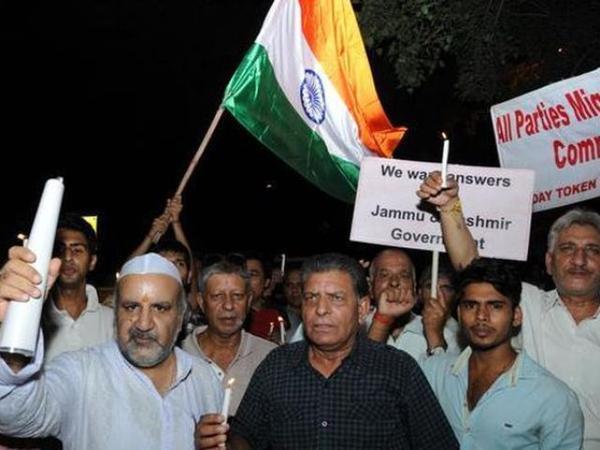 Members of the All Parties Migrants Co-ordination Committee staging a protest and candle march at Jantar Mantar in New Delhi to pay homage to Uri martyrs and demanding that the government take strict action against separatists and their mentors across...