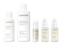 5 Haar- und Kopfhautpflegeprodukte von La Biosthétique. Darunter Shampoo, Conditioner und verschiedene Lotions.