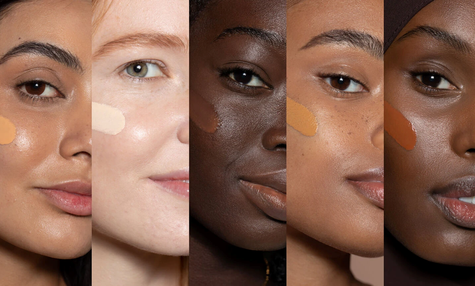 5 Frauen Gesichter mit verschiedenen Hautfarben und Make-up auf der Wange.