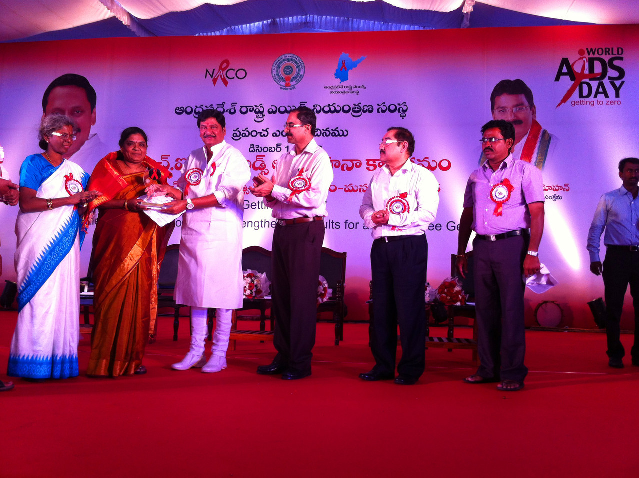 Ms.Jayamma,President receives on behalf of the Organization :" THE BEST CBO LED TI AWARD FROM Andhra Pradesh State AIDS Control Society, Govt.of Andhra Pradesh on World AIDS DAY (Dec.1.2013 at a Public Meeting organized in Hyderabad)