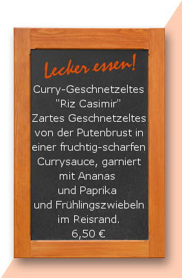 Mittagstisch Curry-Geschnetzeltes "Riz Casimir" Zartes Geschnetzeltes von der Putenbrust in einer fruchtig-scharfen Currysauce, garniert mit Ananas und Paprika und Frühlingszwiebeln im Reisrand.