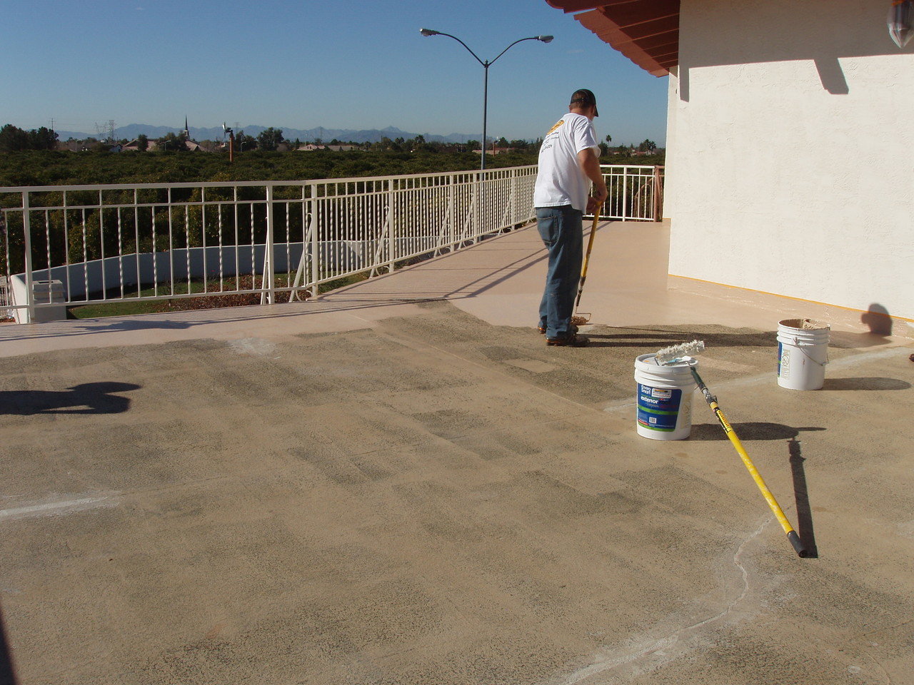 EnviroCoatings - Began applying the first coat of Ceramic InsulCoat Roof at 9AM.  Notice how Ceramic InsulSeal has dried clear.