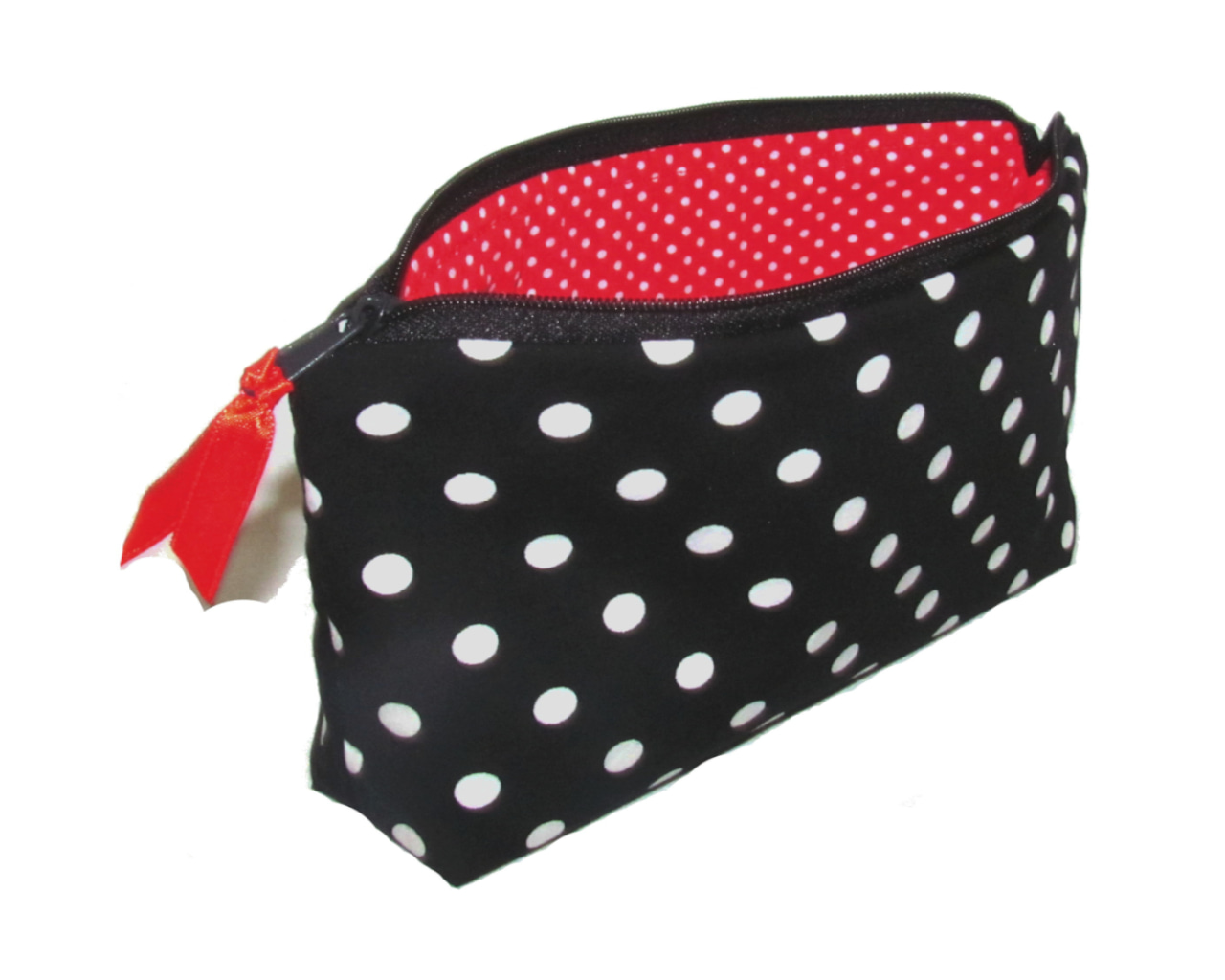 schwarze schminktasche und kosmetiktasche mit weißen punken, innen rot mit punkte in weiss. Verschlossen mit schwarzen reißverschluss