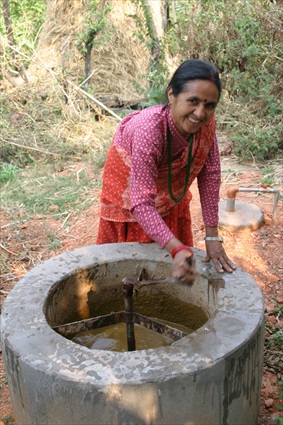 Woman with biogas digestor in Nepal