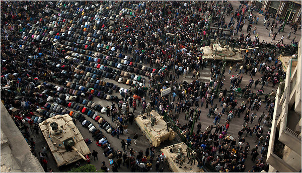 Egyptian protesters prayed Saturday in front of a military vehicles in Tahrir Square in downtown Cairo on Saturday