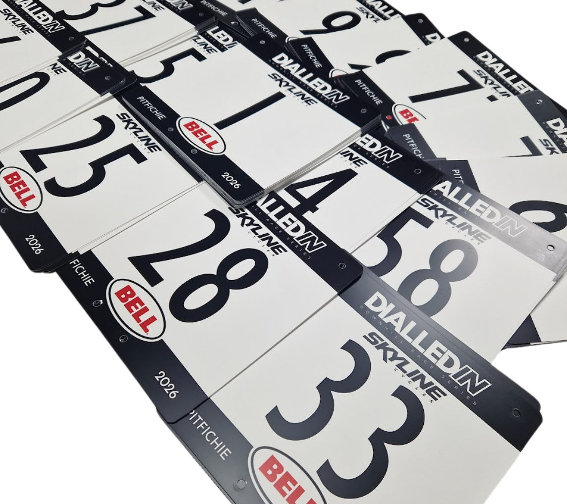 Custom printed reusable PVC MTB race boards in use during the Dialled In Downhill mountain bike race series.