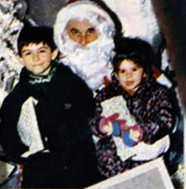 5 year old Declan with little sister Bernadette and a scary looking Santa
