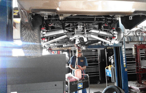 technician bleeds the brakes on a 1986 Chevy Corvette