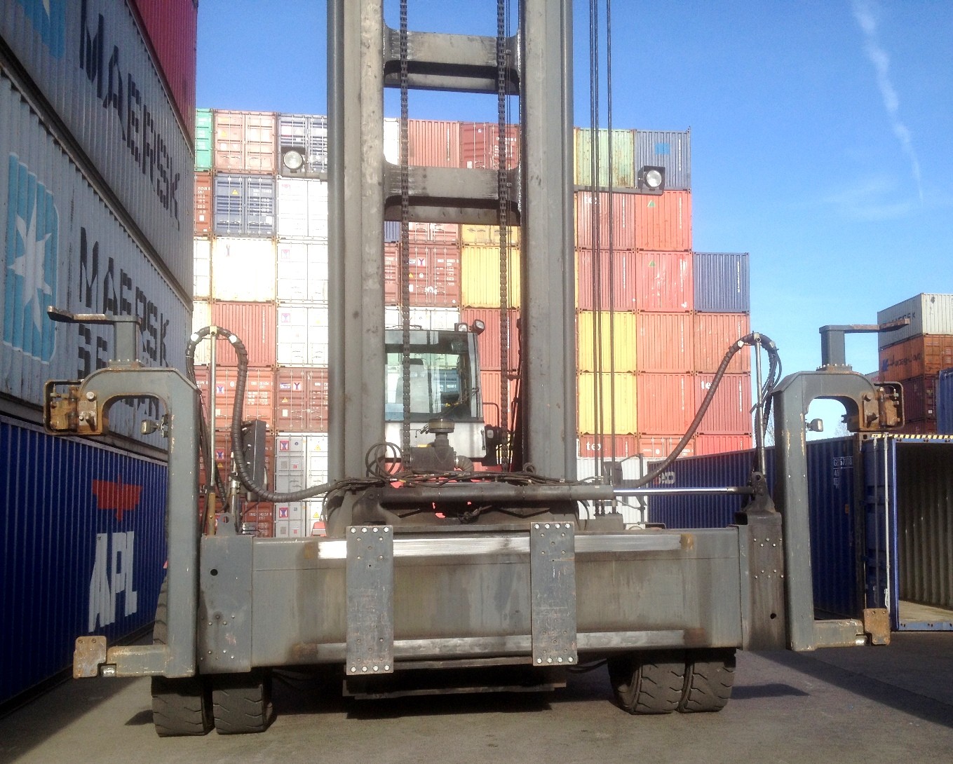 used container handler Kalmar DCE100-45E7 lifts ten tons seven to eight containers high