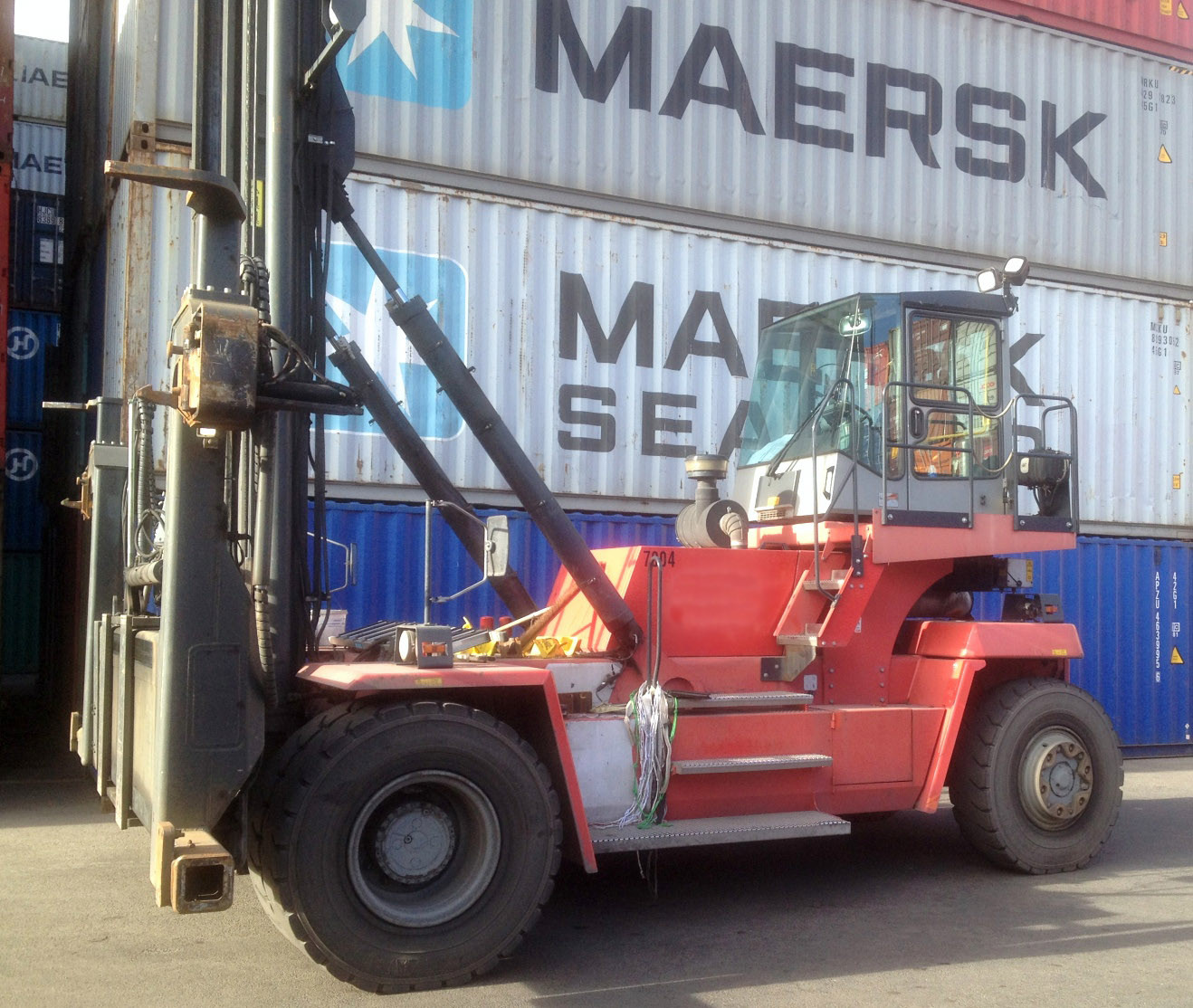 used container handler Kalmar DCE100-45E7 lifts ten tons seven to eight containers high