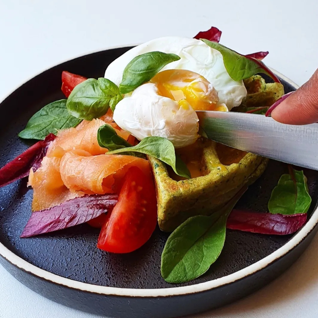 Oatmeal spinach waffle with smoked salmon, poached egg & red chicory