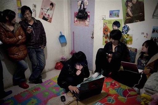 Chinese poor youth socializing. These youth often have cramped living conditions, by Alexander F. Yuan 4/01/2010. 