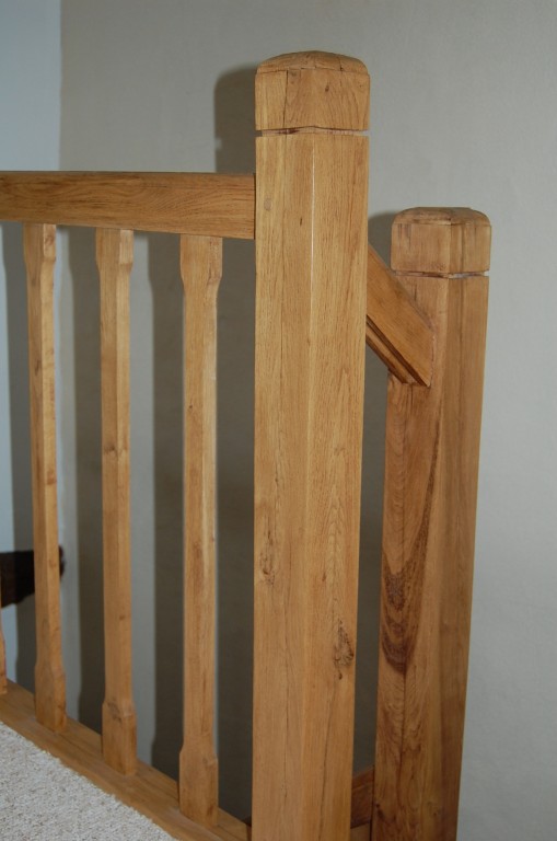 Close up on newel post and handrail