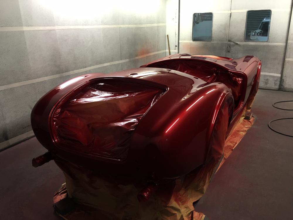 Hawke Cobra shell in spray room, with first coat of red paint, Precision Paint Wellington