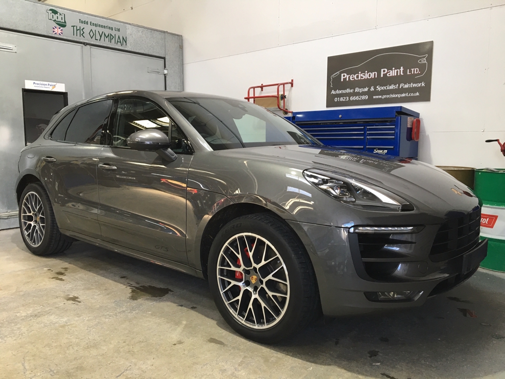 Front Side View of Grey Porsche 4x4 in Precision Paint Workshop