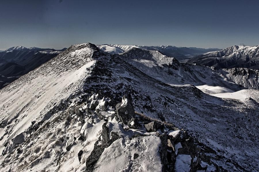 Leaving snowy footprints on the mountain range