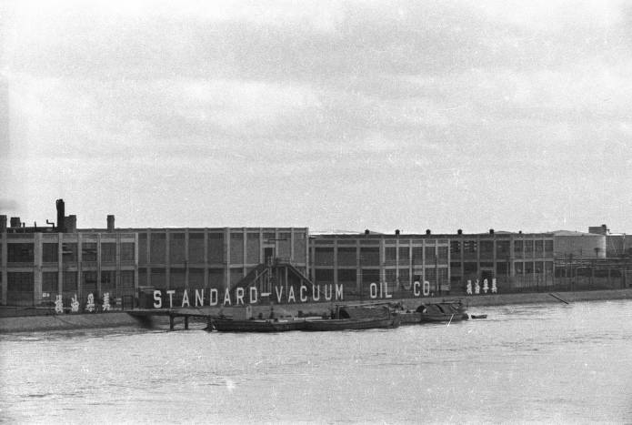 Standard-Vaccum Oil Co. Factory in Shanghai (source: https://collections.lib.uwm.edu/digital/collection/agsphoto/id/6518/ ). Located in Pudong on the Huangpu river across the Shanghai Bund it was opened in December 1929 and primarily produced candles.