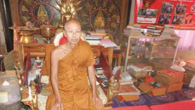 a. Venerable Abbot in his official armchair to receive and bless the devotees in the Hall
