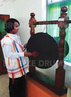 Fig. 6. Playing a drum in the Kayah museum with Kayah colored jacket