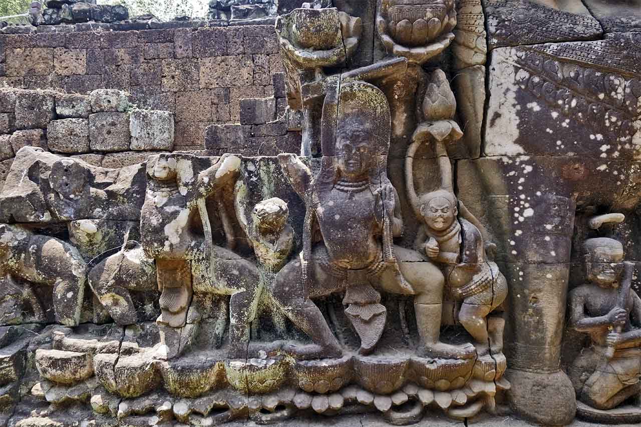 This jester seems to be having a boo-boo and falls on the deity. Lower section. © Patrick Kersalé 2017-2024.